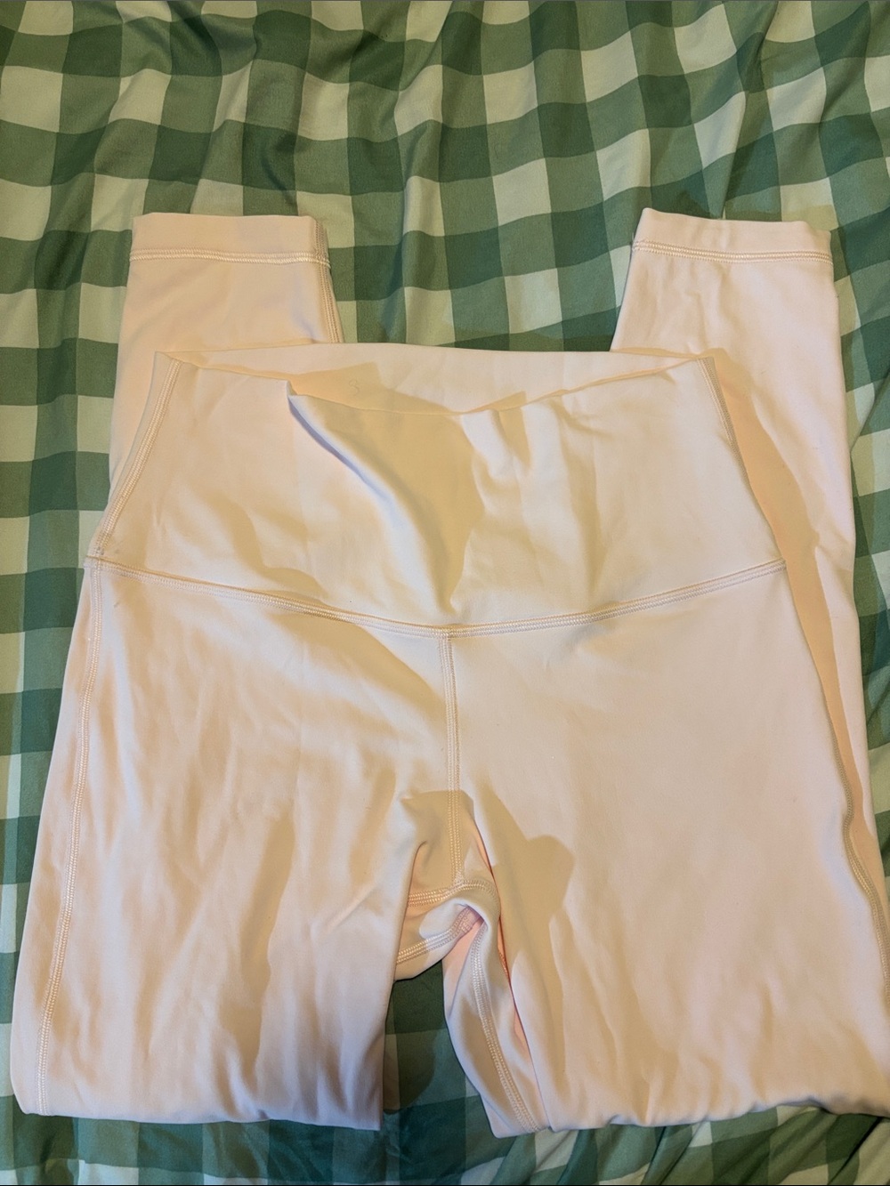 Woman’s Size 8 light pink Lululemon Leggings.
